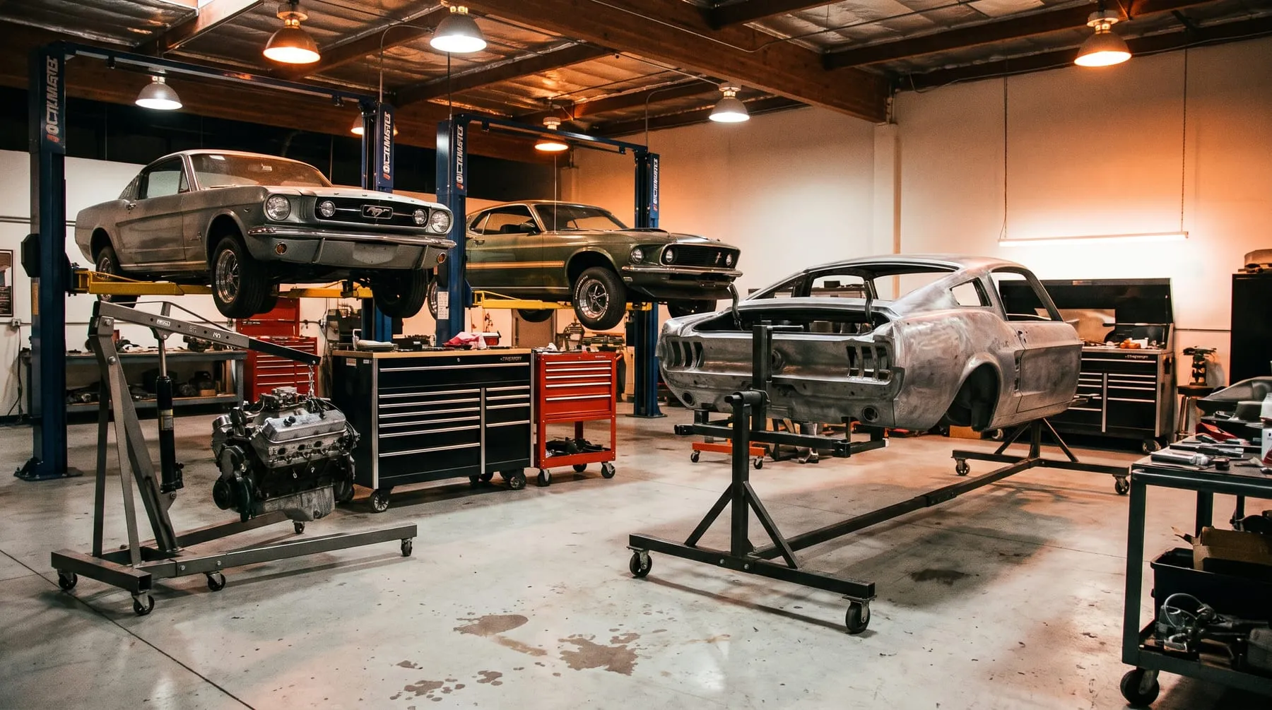 Inside the Mustang Underground restoration shop, classic Mustangs mid-build